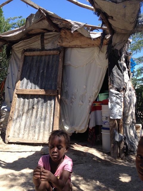 One of Dorci's daughters in front of the "home"